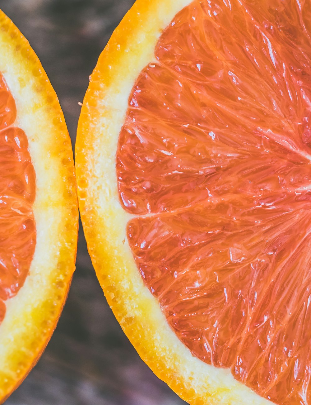 Macro photograph of a freshly cut citrus, the bergamot that opens the fragrance.